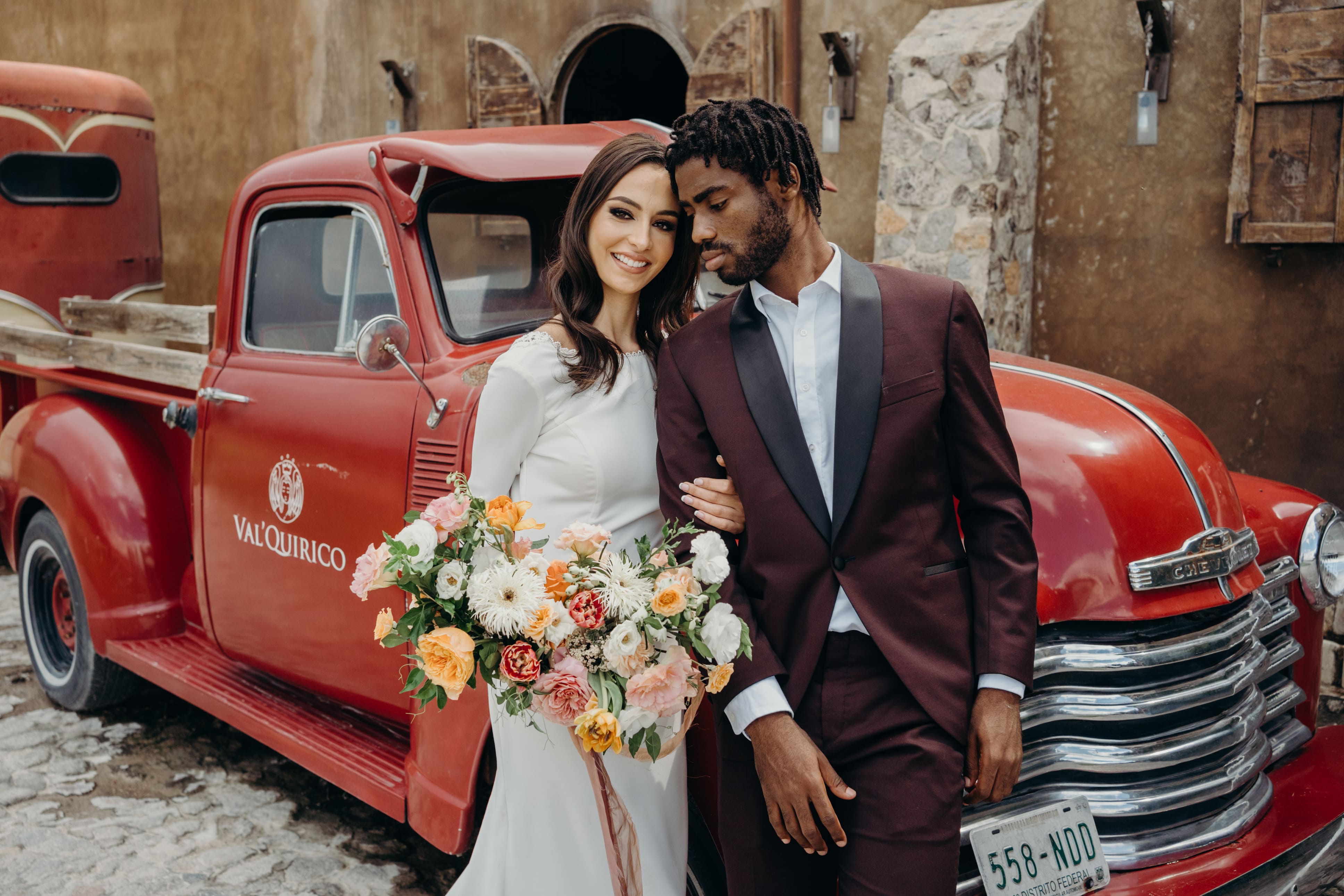 Wedding-couple in front of car